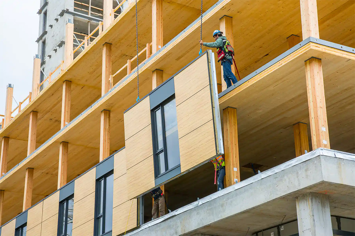 Workers build a Wood skyscraper at UBC