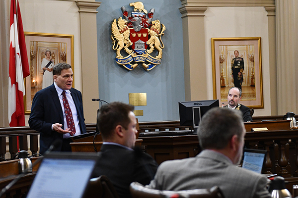 [Principal Daniel Woolf addresses city council]