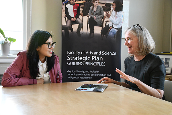 [Barbara Crow, Dean of the Faculty of Arts and Science, right, discusses the faculty’s first strategic plan with student Kate Li.]