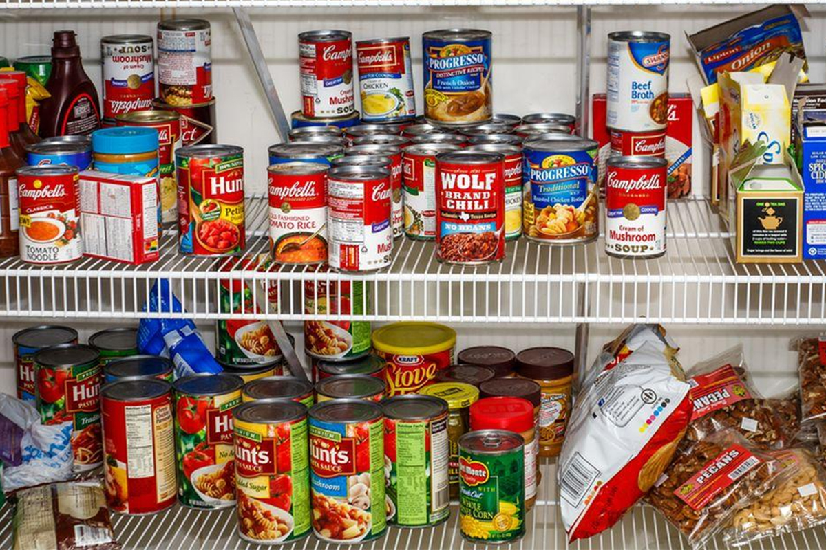 Shelves are filled with non-perishable food items.