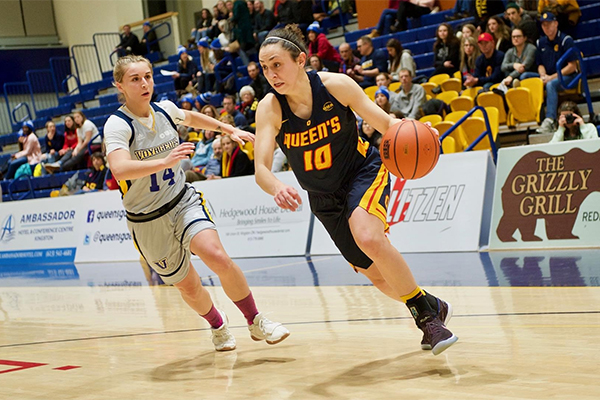 [Marianne Alarie drives the basket]