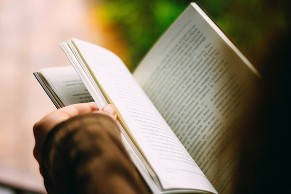 A woman leafs through a book