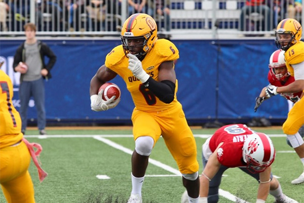 Nelkas Kwemo makes an interception as the Queen's Gaels face the York Lions in Saturday's Homecoming football game at Richardson Stadium.
