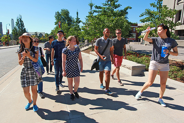 [International students tour Queen's University campus]