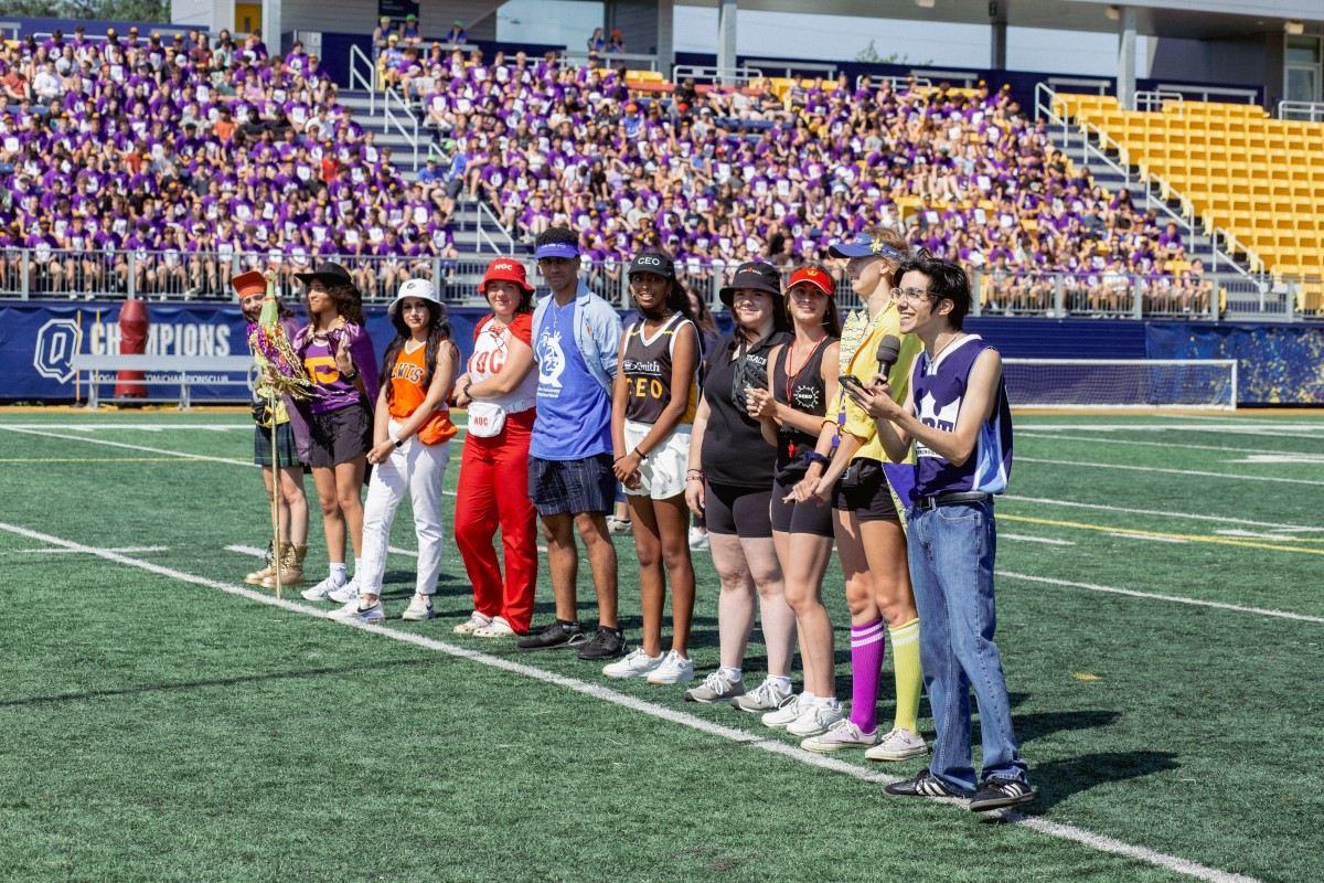 Photograph of student orientation leaders addressing incoming students at orientation event in Richardson Stadium