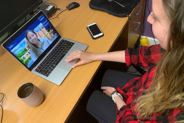 Photograph of a student having a Zoom call with a peer mentor through the Bader International Study Centre.