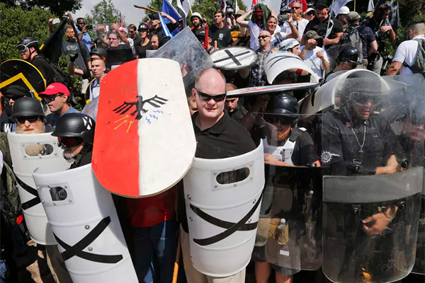 White supremacists hold shields in Charlottesville, Va.]