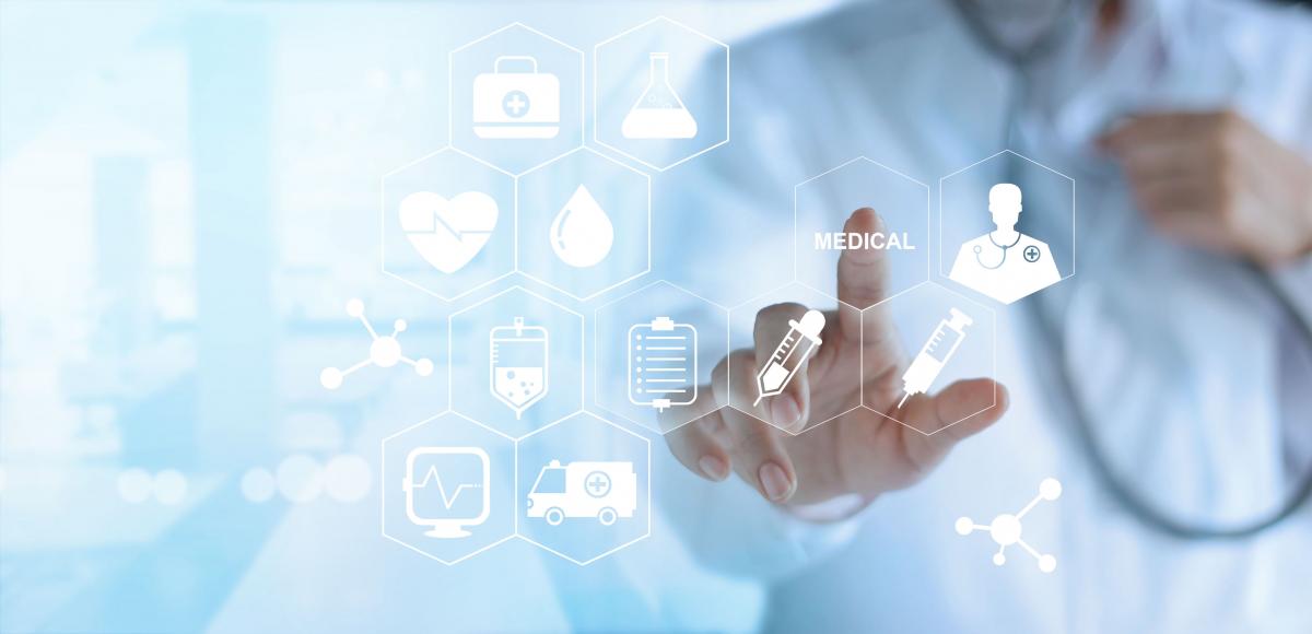 A doctor uses a touch screen. (iStock)