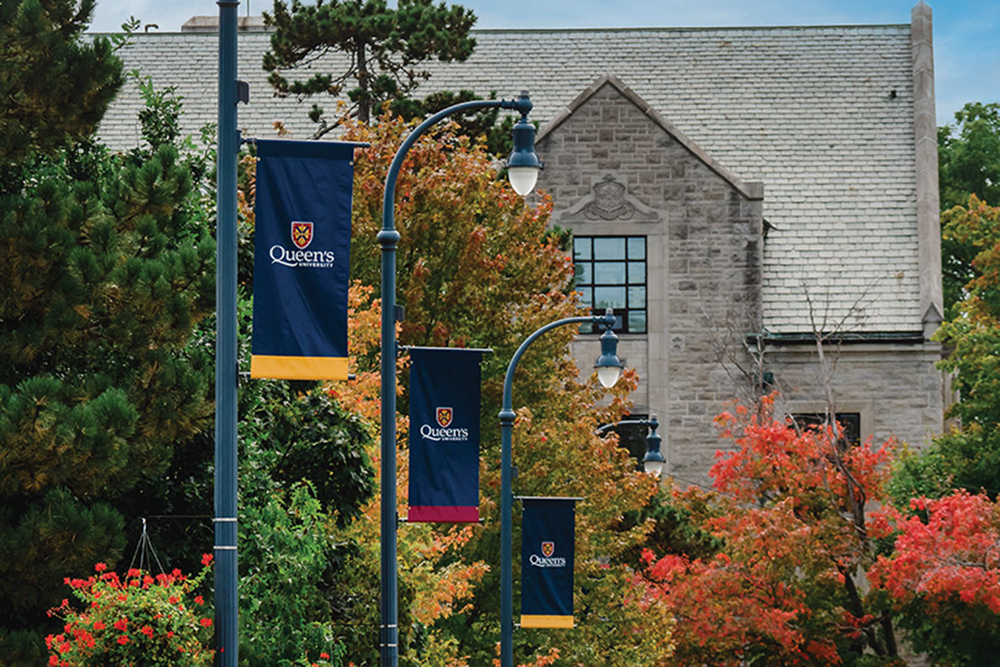Queen's banners hanging from lamp posts along campus' University Avenue.