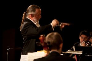 [Queen's Symphony Orchestra director Gordon Craig]