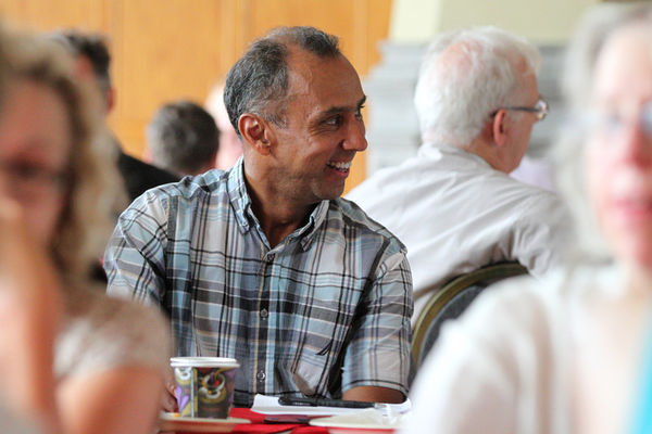 [Jonathan Rose speaks with community members]