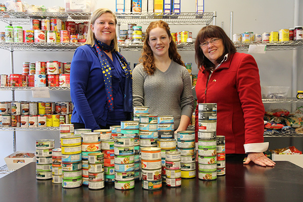 [Sue Bates and Lee Wetherall present cans of tuna to Devin Cleary]