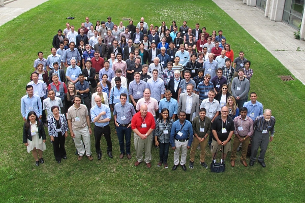 [Conference participants pose for photo]