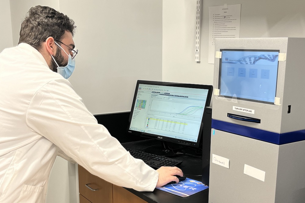 [Post-Doctoral Fellow, Dr. Abdul Rahman Alashraf examines the results of a test for viruses]