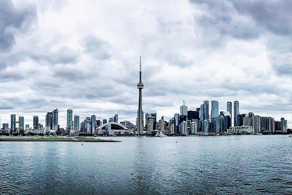 [Photo of Toronto skyline featuring the CN Tower]