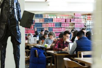 [Students working in library]