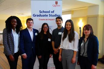 Graduate students Titilope-Oluwa Adebola, Anika Cloutier, Andrew Coombs, Zaid Taha, Priscila de Oliveira Falcao, and Katie Alyssa Hunt prepare for their presentations at the Research Showcase. (University Communications)
