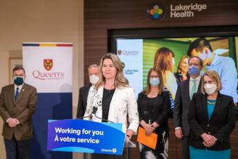 Representatives from Queen's, the Government of Ontario, and Lakeridge Health deliver remarks at the press event.