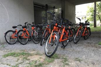This 'haven', or drop-off location, by Macintosh-Corry has been well stocked with Dropbike's signature orange cycles.