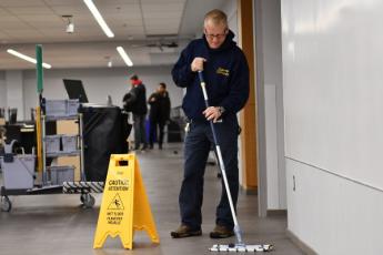 Custodial Services cleans classroom in Mitchell Hall