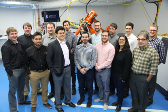 The Laser Depth Dynamics team, including chief technical officer and co-founder Paul Webster (Sc'06, PhD'13) (third from the left in the front row). (University Communications)