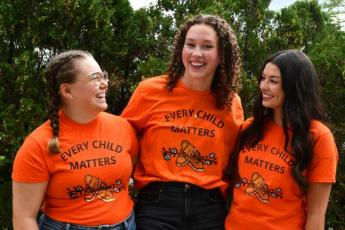 Photograph of students wearing orange shirts recognizing National Day for Truth and Reconciliation