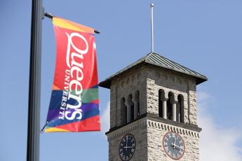Queen's banner and Grant Hall clock tower