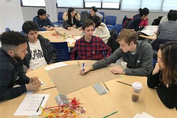 Students participating in Queen's Cares attend a workshop