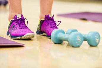 photo of exercise shoes and weights