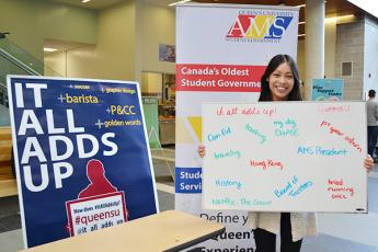 Jenn Li (ConEd’17), President of the Alma Mater Society, visited the It All Adds Up booth at the Athletics and Recreation Centre, and filled up the white board with how her university experience adds up for her. (Photo by Candice Pinto)