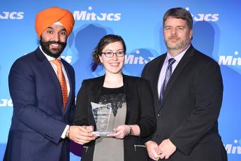 Caitlin Miron, Queen’s PhD student, presented with the Mitacs PhD Award for Oustanding Innovation by Navdeep Bains, Minister of Innovation, Science and Economic Development (left) and Jim Banting, Assistant Vice-Principal of Partnerships and Innovation at Queen’s (right).