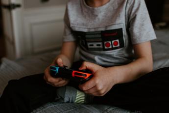 A boy plays on a Nintendo Switch