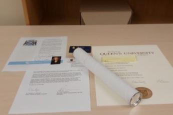 Photo of a diploma and congratulatory letters