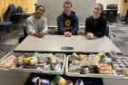 Varsity Leadership Council executive with food donations to Martha's Table