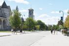 People walk along University Avenue