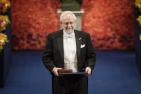 Art McDonald holding his Nobel Prize at the 2015 award ceremony