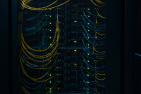 A server rack full of yellow and blue wires