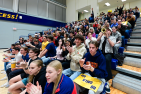 Students cheering in the bleachers
