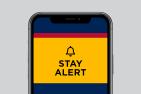 Alert logo on a phone face