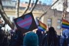 Signs in the air at a rally in support of trans rights 