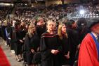 Graduates standing during ceremonies.