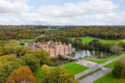 A castle in the middle of a green landscape. 