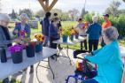 A group of people participate in a flower arranging workshop