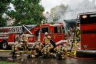 Firefighters cooling down after fighting a fire.