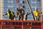 Construction workers in the sun.