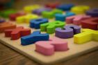 Children's wooden letter blocks on table.