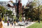 Students walk past Nixon Field and Theological Hall. (University Relations)