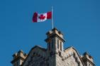 Canadian flag flying atop a Queen's building