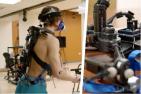 Exoskeleton device strapped to the back of a user as they walk on a treadmill. Image is split in half by a second image that shows a close-up of the device's mechanics.