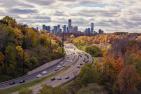 Aerial photography of passing vehicles on highway leading to Toronto.